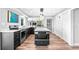 Spacious kitchen featuring modern appliances, an island with a cooktop, and ample storage at 647 Ridgewood Dr, Windermere, FL 34786