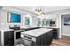 Open concept kitchen with island and stainless steel appliances at 647 Ridgewood Dr, Windermere, FL 34786