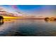 Beautiful view of a serene lake at sunset, reflecting vibrant colors across the calm water at 647 Ridgewood Dr, Windermere, FL 34786