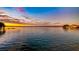 Peaceful lake view at sunset with beautiful colors in the sky at 647 Ridgewood Dr, Windermere, FL 34786