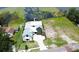 Stunning aerial view of lakeside home with modern architecture and large lot, creating a serene waterfront oasis at 1340 Susannah Blvd, Orlando, FL 32803