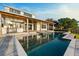 Stunning backyard with a pool, spa, and covered patio, designed for ultimate relaxation and entertainment at 1340 Susannah Blvd, Orlando, FL 32803