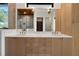 Stylish bathroom vanity with double sinks, modern fixtures, and patterned accent wall at 1340 Susannah Blvd, Orlando, FL 32803