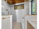Sleek bathroom featuring wood ceilings, modern fixtures and tiling at 1340 Susannah Blvd, Orlando, FL 32803