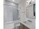 Bright bathroom with a shower and bathtub combo with modern fixtures and tiling at 1340 Susannah Blvd, Orlando, FL 32803