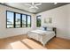 A bedroom with a bed features a modern ceiling fan, recessed lighting, and picturesque backyard view at 1340 Susannah Blvd, Orlando, FL 32803