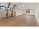 A very large, well-lit bedroom with wood flooring and architectural wood beam details at 1340 Susannah Blvd, Orlando, FL 32803