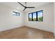 Bedroom with modern ceiling fan and large windows at 1340 Susannah Blvd, Orlando, FL 32803