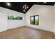 Bedroom featuring hardwood floors, large windows, and modern trim at 1340 Susannah Blvd, Orlando, FL 32803
