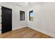 A naturally lit bedroom with hardwood floors and black door and window trim at 1340 Susannah Blvd, Orlando, FL 32803