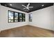 A bright bedroom features a dark wood ceiling, recessed lighting, and oversized window at 1340 Susannah Blvd, Orlando, FL 32803