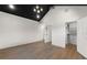 Bright bedroom boasts a dark wood ceiling, hardwood floors, and an organized walk-in closet at 1340 Susannah Blvd, Orlando, FL 32803