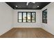 Bright room featuring a dark ceiling, hardwood floors, and water views at 1340 Susannah Blvd, Orlando, FL 32803