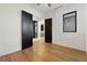 Bedroom with wood flooring and view into the kitchen area at 1340 Susannah Blvd, Orlando, FL 32803