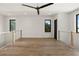 Bright bonus room features plank flooring, a modern railing, and oversized windows at 1340 Susannah Blvd, Orlando, FL 32803