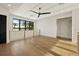 Bright bonus room features plank flooring, a modern railing, and views of the surrounding landscape at 1340 Susannah Blvd, Orlando, FL 32803