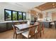 Bright dining room featuring a large table, modern lighting, and kitchen in the background at 1340 Susannah Blvd, Orlando, FL 32803
