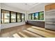 Bright dining room with modern cabinets, stainless steel refrigerator, and large windows overlooking the backyard at 1340 Susannah Blvd, Orlando, FL 32803