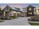 Stylish exterior featuring a modern design, metal roof, three-car garage, and paved driveway at 1340 Susannah Blvd, Orlando, FL 32803