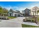 Beautiful two-story home with a modern design, three-car garage, and manicured lawn at 1340 Susannah Blvd, Orlando, FL 32803