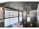 Spacious garage with epoxy flooring, modern doors, and high ceilings with ample lighting at 1340 Susannah Blvd, Orlando, FL 32803