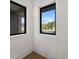 Hallway with natural light shining through black framed windows at 1340 Susannah Blvd, Orlando, FL 32803