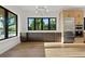 Bright kitchen with custom cabinets, stainless appliances, hardwood floors, and large window with a backyard view at 1340 Susannah Blvd, Orlando, FL 32803