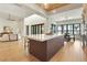 Bright and spacious kitchen with large island and modern appliances open to dining area and living room at 1340 Susannah Blvd, Orlando, FL 32803