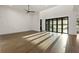 Open-concept living space with floor to ceiling doors offering natural light and water views at 1340 Susannah Blvd, Orlando, FL 32803