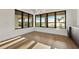 Bright living space featuring hardwood floors, large windows, and lake views at 1340 Susannah Blvd, Orlando, FL 32803