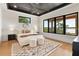 Modern main bedroom with a large window, tray ceiling, neutral colors, and an elegant area rug at 1340 Susannah Blvd, Orlando, FL 32803