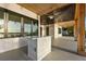 Covered outdoor bar area featuring light countertops, ceiling fans, and beautiful outdoor views at 1340 Susannah Blvd, Orlando, FL 32803