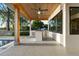 Outdoor kitchen space with built-in grill, stainless steel appliances, and a spacious concrete patio at 1340 Susannah Blvd, Orlando, FL 32803
