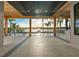 Expansive outdoor patio area featuring a pool, lake view, wood ceiling, and modern architecture at 1340 Susannah Blvd, Orlando, FL 32803