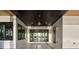Inviting outdoor patio with dark wood ceilings and retractable doors with views of the water at 1340 Susannah Blvd, Orlando, FL 32803