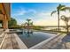 Stunning backyard pool featuring a lake view and a beautiful sunset at 1340 Susannah Blvd, Orlando, FL 32803