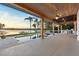 View from the outdoor patio to the infinity pool and waterfront of the lake at 1340 Susannah Blvd, Orlando, FL 32803