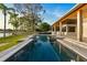Contemporary swimming pool design reflecting the sky, seamlessly blending with the home's outdoor living space at 1340 Susannah Blvd, Orlando, FL 32803