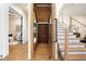Custom wine cellar under the stairs with glass door, wooden racks, and lighting at 1340 Susannah Blvd, Orlando, FL 32803