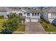 Stunning two-story house with paver driveway, nice landscaping at 1402 Olympic Club Blvd, Champions Gate, FL 33896