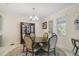 Dining room with a round table, six chairs, and a china cabinet at 1402 Olympic Club Blvd, Champions Gate, FL 33896