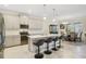 Spacious kitchen with an island, stainless steel appliances, and gray cabinets at 1402 Olympic Club Blvd, Champions Gate, FL 33896