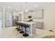 Island kitchen with stainless steel appliances and gray cabinets at 1402 Olympic Club Blvd, Champions Gate, FL 33896