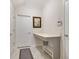 Functional laundry room with built-in counter and storage at 1402 Olympic Club Blvd, Champions Gate, FL 33896