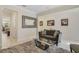 Living room with a gray couch, coffee table, and large mirror at 1402 Olympic Club Blvd, Champions Gate, FL 33896