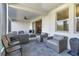 Relaxing screened patio with wicker furniture, perfect for outdoor enjoyment at 1402 Olympic Club Blvd, Champions Gate, FL 33896
