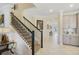 Elegant staircase with an iron railing leading to the upper level at 1402 Olympic Club Blvd, Champions Gate, FL 33896