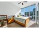Cozy bedroom with natural light, featuring a comfortable bed and modern furnishings at 155 S Court Ave # 1602, Orlando, FL 32801