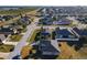 Expansive aerial view of a residential community, highlighting well-maintained homes and neighborhood streets at 1218 Coda Ct, Dundee, FL 33838