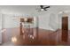 Expansive living room featuring hardwood floors, a bar, and an open staircase, perfect for entertaining at 1392 Indiana Ave, Winter Park, FL 32789